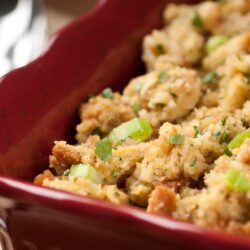 Women's Bean Project Golden Cornbread Stuffing in a red casserole dish.