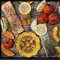 Oven-baked salmon and vegetables seasoned with Women's Bean Project Dill Spice Blend.